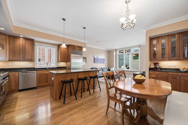 3329 N Bell Ave, Chicago, IL 60618 - dining space with plenty of natural light, light wood-style floors, ornamental molding, and a chandelier