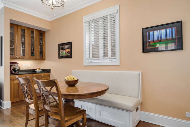 3329 N Bell Ave, Chicago, IL 60618 - dining area with ornamental molding, dark wood finished floors, and a chandelier