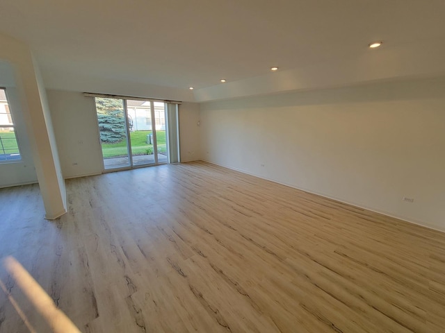 13663 Whittingham Ln, Huntley, IL 60142 - unfurnished room featuring plenty of natural light, light wood-style flooring, recessed lighting, and baseboards