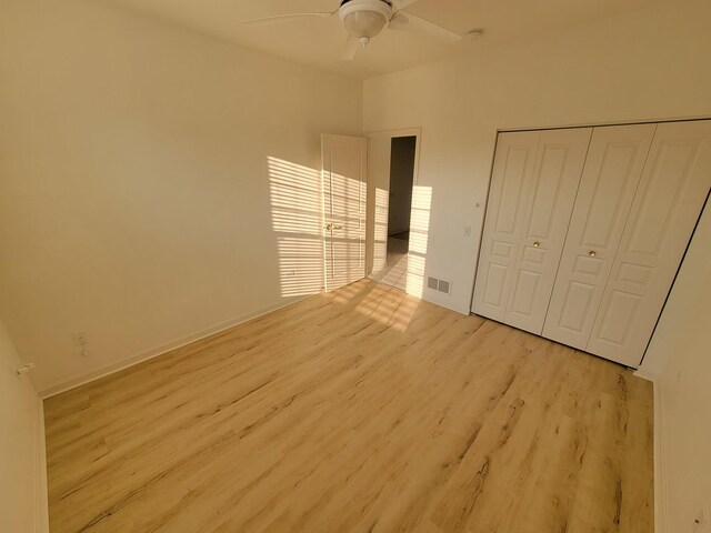 13663 Whittingham Ln, Huntley, IL 60142 - unfurnished bedroom featuring light wood-type flooring, a closet, ceiling fan, and baseboards