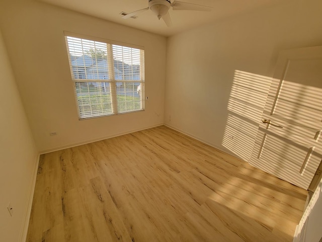 13663 Whittingham Ln, Huntley, IL 60142 - spare room featuring wood finished floors, ceiling fan, and baseboards