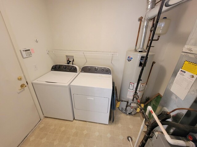 13663 Whittingham Ln, Huntley, IL 60142 - washroom featuring water heater, washing machine and dryer, and light floors