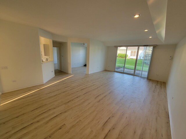 13663 Whittingham Ln, Huntley, IL 60142 - empty room with light wood-type flooring, recessed lighting, expansive windows, baseboards, and a ceiling fan