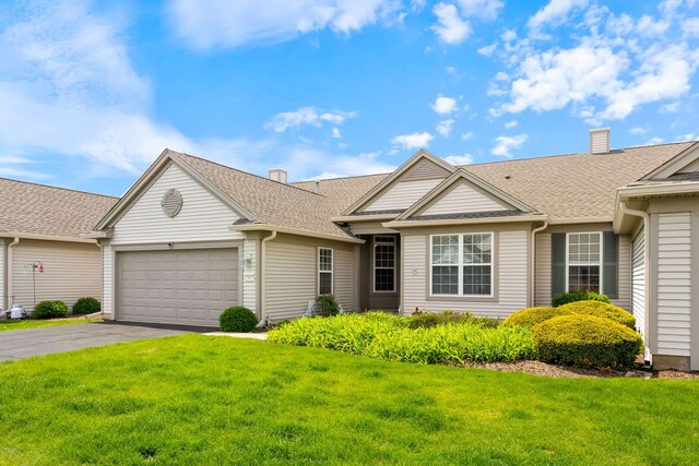13663 Whittingham Ln, Huntley, IL 60142 - view of front of property featuring an attached garage, a front yard, asphalt driveway, and a chimney