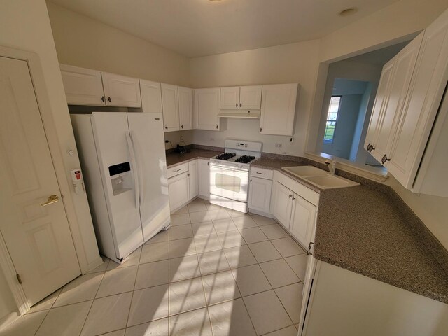 13663 Whittingham Ln, Huntley, IL 60142 - kitchen featuring white appliances, a sink, dark countertops, white cabinetry, and light tile patterned floors