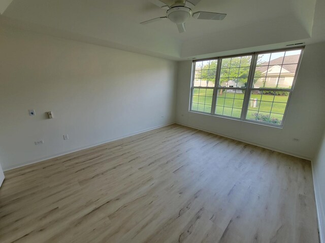 13663 Whittingham Ln, Huntley, IL 60142 - spare room featuring light wood finished floors, a ceiling fan, and baseboards