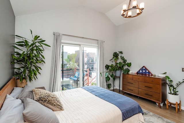 2737 W Thomas St Unit 3, Chicago, IL 60622 - bedroom featuring vaulted ceiling, a chandelier, light wood-style floors, and access to exterior