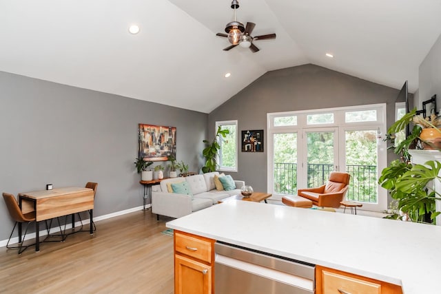 2737 W Thomas St Unit 3, Chicago, IL 60622 - kitchen featuring stainless steel dishwasher, open floor plan, ceiling fan, light wood-style flooring, and baseboards