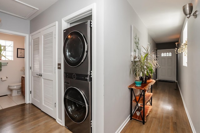 2737 W Thomas St Unit 3, Chicago, IL 60622 - laundry area with stacked washer / dryer, wood finished floors, and baseboards