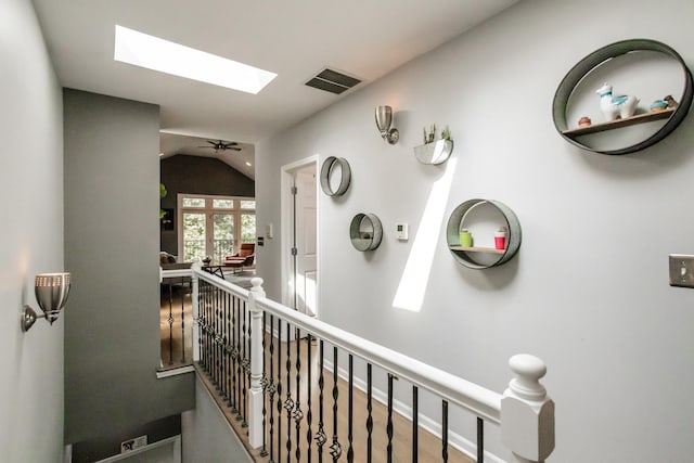 2737 W Thomas St Unit 3, Chicago, IL 60622 - hallway with vaulted ceiling, a skylight, and an upstairs landing