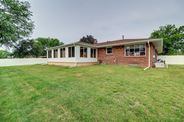 611 Marsha Ln, Rock Falls, IL 61071 - back of house with a chimney and brick siding