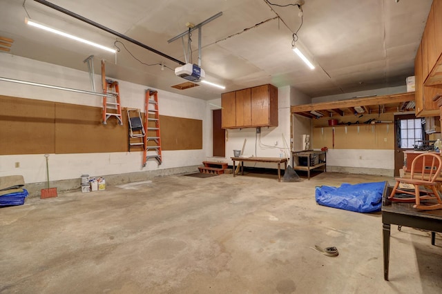 611 Marsha Ln, Rock Falls, IL 61071 - garage featuring a garage door opener and a workshop area