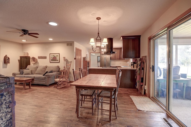 611 Marsha Ln, Rock Falls, IL 61071 - dining room featuring wood finished floors, recessed lighting, a chandelier, and ceiling fan