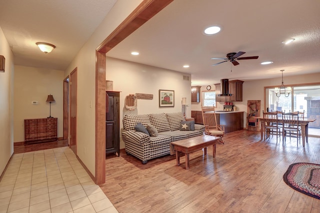 611 Marsha Ln, Rock Falls, IL 61071 - living area with light wood-style flooring, a ceiling fan, recessed lighting, and a chandelier
