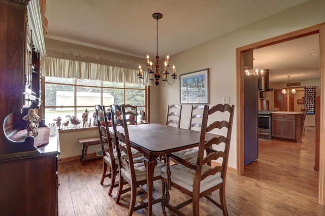 611 Marsha Ln, Rock Falls, IL 61071 - dining room with a chandelier, hardwood / wood-style flooring, baseboards, and a textured ceiling