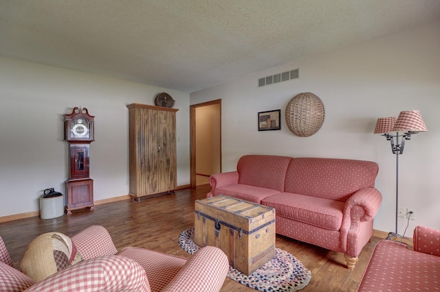 611 Marsha Ln, Rock Falls, IL 61071 - living room featuring wood finished floors, baseboards, and a textured ceiling