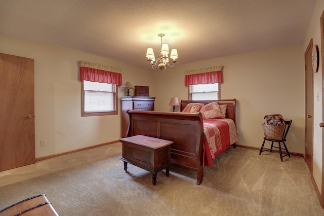 611 Marsha Ln, Rock Falls, IL 61071 - carpeted bedroom with a chandelier, multiple windows, baseboards, and a textured ceiling
