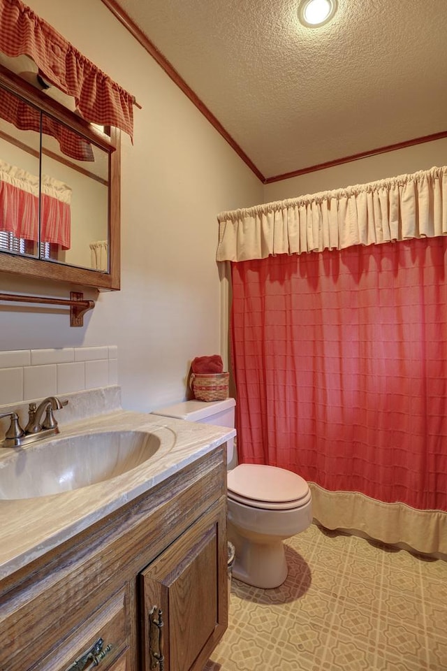 611 Marsha Ln, Rock Falls, IL 61071 - full bath featuring vanity, toilet, a textured ceiling, lofted ceiling, and ornamental molding