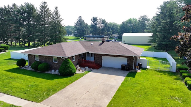 611 Marsha Ln, Rock Falls, IL 61071 - ranch-style house featuring a garage, brick siding, a gate, concrete driveway, and roof with shingles