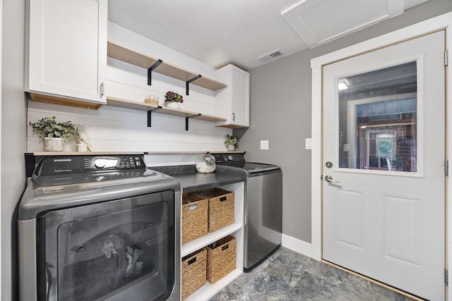 7308 W Lancaster Rd, Peoria, IL 61607 - washroom featuring cabinet space, attic access, washer and clothes dryer, and baseboards