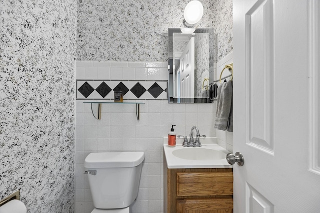 7308 W Lancaster Rd, Peoria, IL 61607 - bathroom featuring vanity, toilet, and tile walls