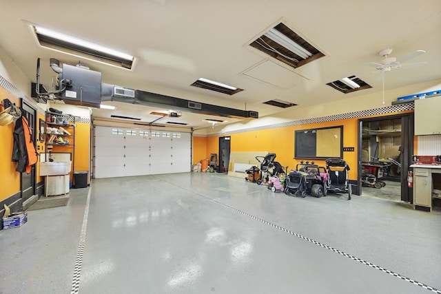 7308 W Lancaster Rd, Peoria, IL 61607 - garage with a ceiling fan
