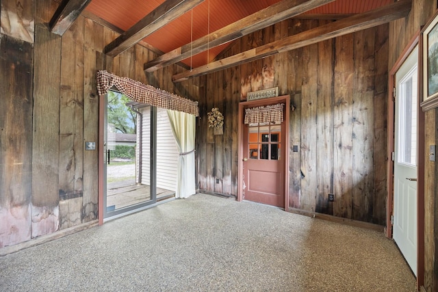 7308 W Lancaster Rd, Peoria, IL 61607 - carpeted empty room featuring wooden walls and wood ceiling