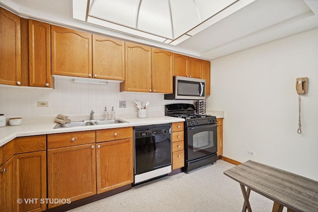 1653 River St Unit 405, Des Plaines, IL 60016 - kitchen featuring black appliances, a sink, tasteful backsplash, and light countertops
