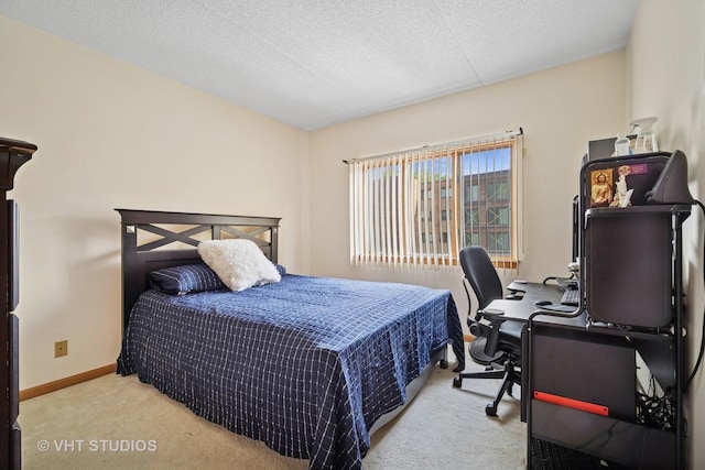 1653 River St Unit 405, Des Plaines, IL 60016 - carpeted bedroom with baseboards, a desk, and a textured ceiling