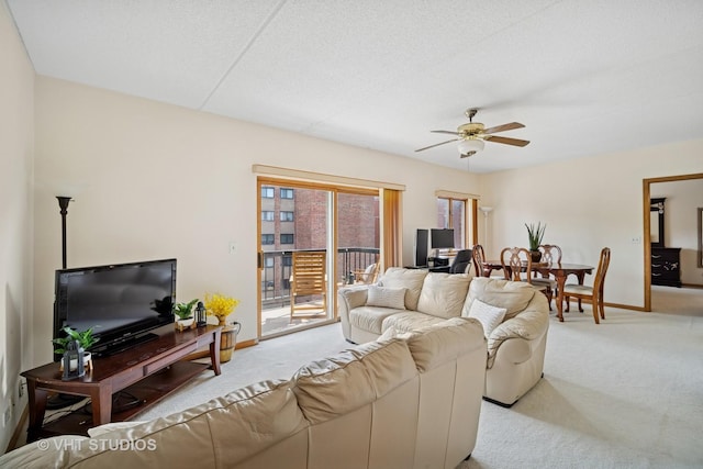 1653 River St Unit 405, Des Plaines, IL 60016 - carpeted living room with baseboards and a ceiling fan