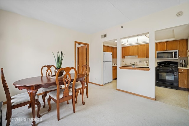 1653 River St Unit 405, Des Plaines, IL 60016 - dining area with light carpet and baseboards