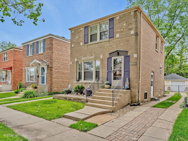 4154 Elm Ave, Brookfield, IL 60513 - view of front of property with brick siding, a garage, a front lawn, and an outbuilding