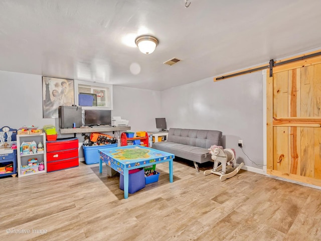 4154 Elm Ave, Brookfield, IL 60513 - playroom with wood finished floors and a barn door