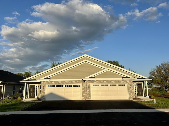 896 Fuller Ln, Belvidere, IL 61008 - view of front of house with driveway and a garage