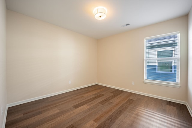 896 Fuller Ln, Belvidere, IL 61008 - unfurnished room featuring dark wood-style floors and baseboards