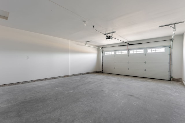 896 Fuller Ln, Belvidere, IL 61008 - garage featuring a garage door opener and baseboards