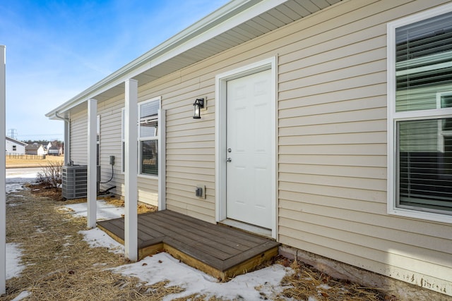 896 Fuller Ln, Belvidere, IL 61008 - snow covered property entrance with central AC