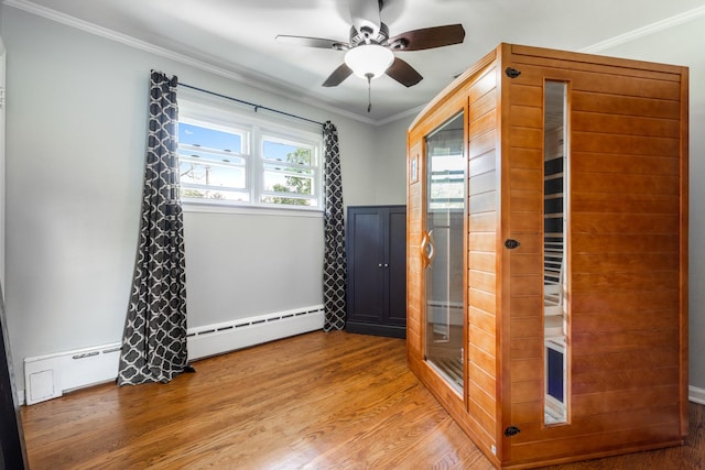 814 S Harvard Ave, Villa Park, IL 60181 - unfurnished room with a relaxing sauna, ornamental molding, wood finished floors, a ceiling fan, and baseboard heating