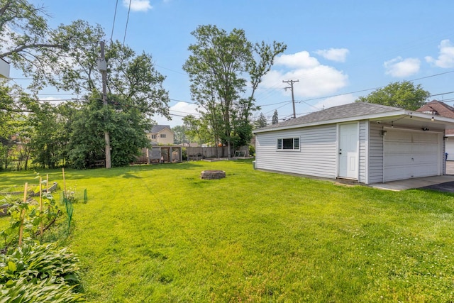 814 S Harvard Ave, Villa Park, IL 60181 - view of yard with an outdoor fire pit, a garage, and an outbuilding