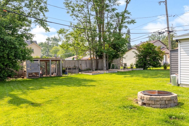 814 S Harvard Ave, Villa Park, IL 60181 - view of yard with an outdoor fire pit, a vegetable garden, an outbuilding, and exterior structure