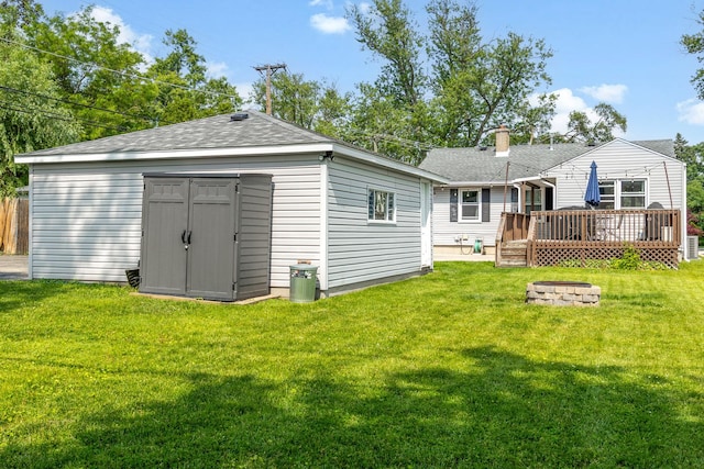 814 S Harvard Ave, Villa Park, IL 60181 - rear view of house featuring a fire pit, a wooden deck, a yard, and roof with shingles