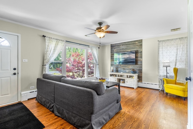 814 S Harvard Ave, Villa Park, IL 60181 - living area featuring baseboard heating, a baseboard heating unit, ornamental molding, ceiling fan, and plenty of natural light
