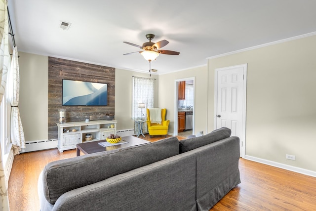 814 S Harvard Ave, Villa Park, IL 60181 - living room featuring a ceiling fan, ornamental molding, baseboard heating, and wood finished floors