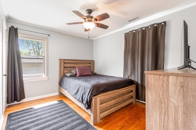 814 S Harvard Ave, Villa Park, IL 60181 - bedroom with wood finished floors, crown molding, and ceiling fan