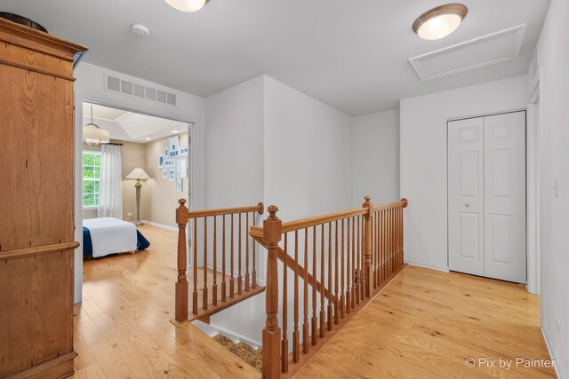 5611 Wildspring Dr, Lake In The Hills, IL 60156 - corridor featuring an upstairs landing, light wood-style flooring, and baseboards