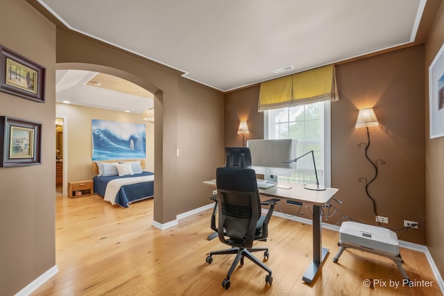 5611 Wildspring Dr, Lake In The Hills, IL 60156 - office space featuring arched walkways, light wood-style flooring, and baseboards