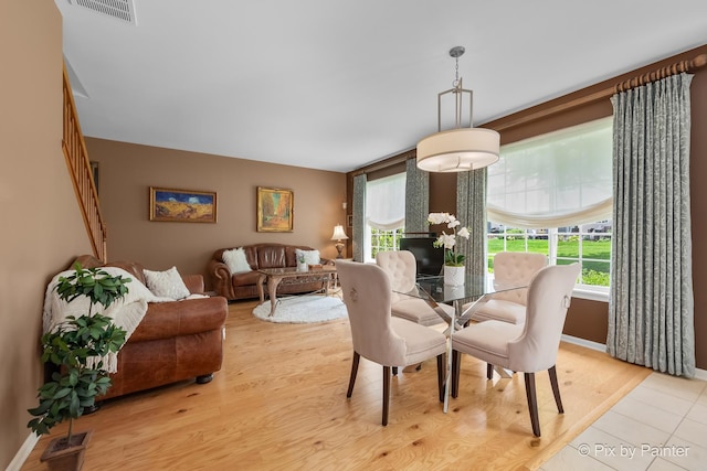 5611 Wildspring Dr, Lake In The Hills, IL 60156 - dining area with light wood-style flooring and baseboards