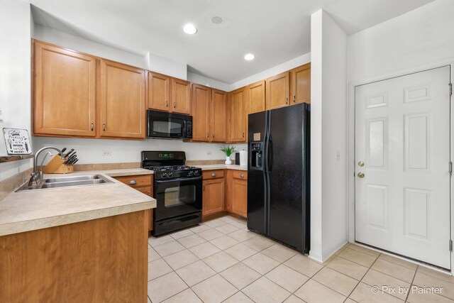 5611 Wildspring Dr, Lake In The Hills, IL 60156 - kitchen featuring black appliances, a sink, light tile patterned floors, light countertops, and recessed lighting