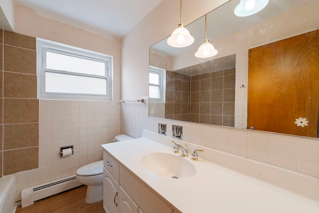 6248 W Montrose Ave Unit 1R, Chicago, IL 60634 - bathroom with tile walls, a baseboard heating unit, toilet, vanity, and a bathtub