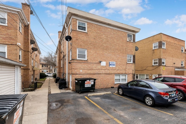 6248 W Montrose Ave Unit 1R, Chicago, IL 60634 - view of property featuring uncovered parking